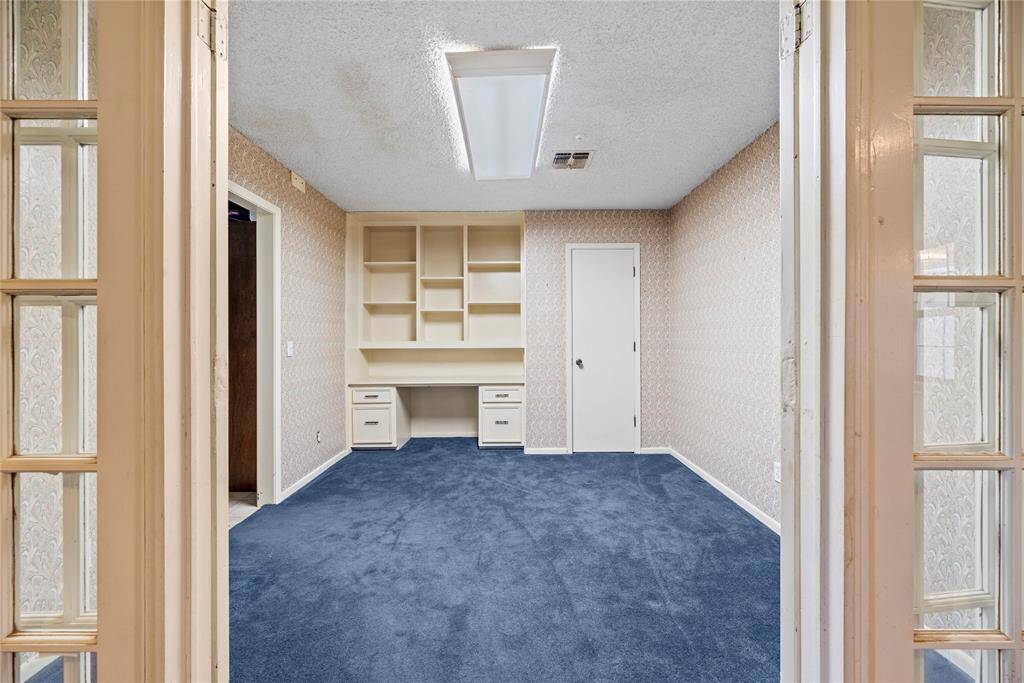 Study has french doors and is connected to living room and converted garage.