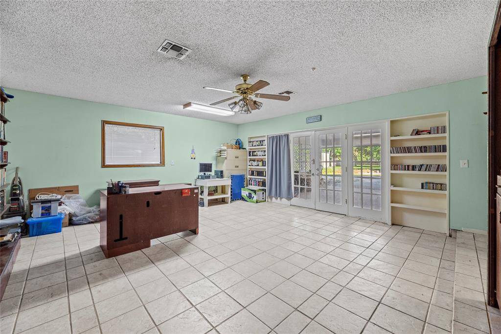 Converted garage space looks to have been used as an office area.
