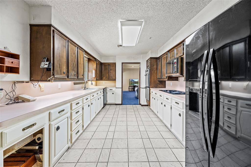 Large kitchen is wider than it appears.