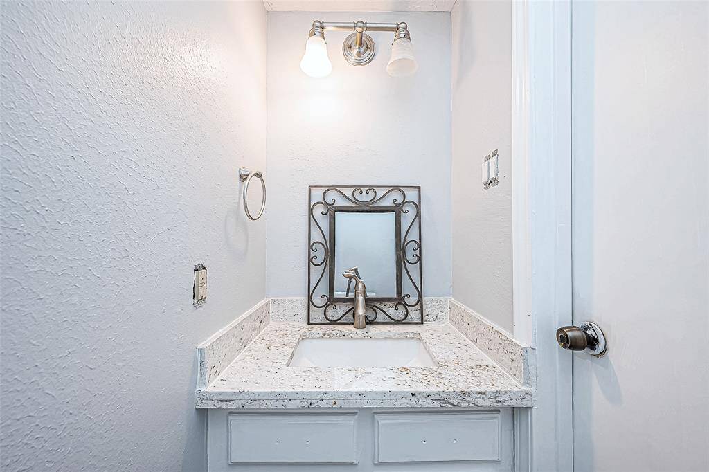 Downstairs half bath right off the kitchen.