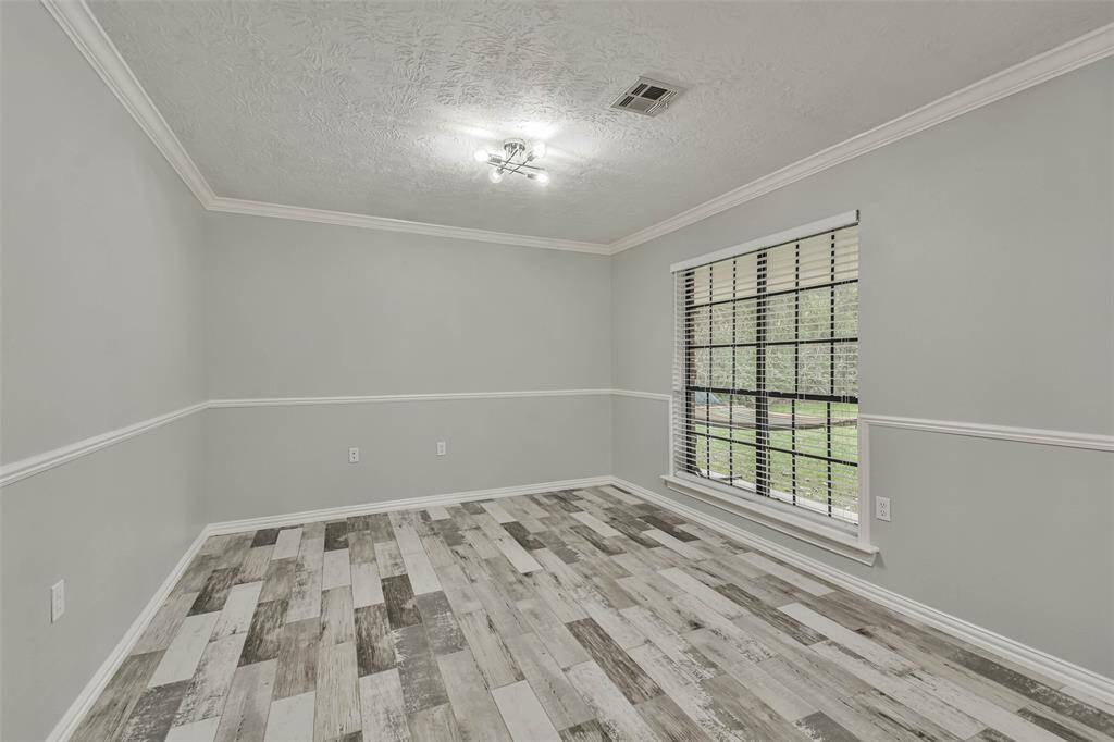 Area to the right of entry way. Can be used as an office area or large dining area.