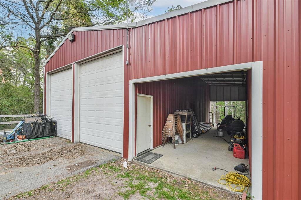 2 bay shop with covered storage area. The guest house is combined with the shop and storage area and is to the right in this picture.