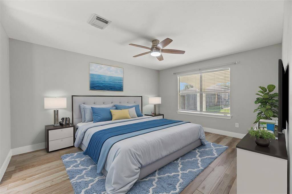 How perfect is this primary space? Spacious and bathed in natural light, with wood-like vinyl planks, creates a warm comfortable space to relax and unwind.