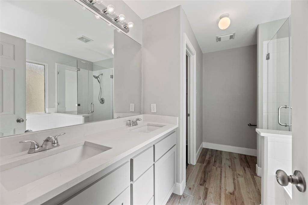 Dual vanities offer personal space with tons of dedicated cabinet space.