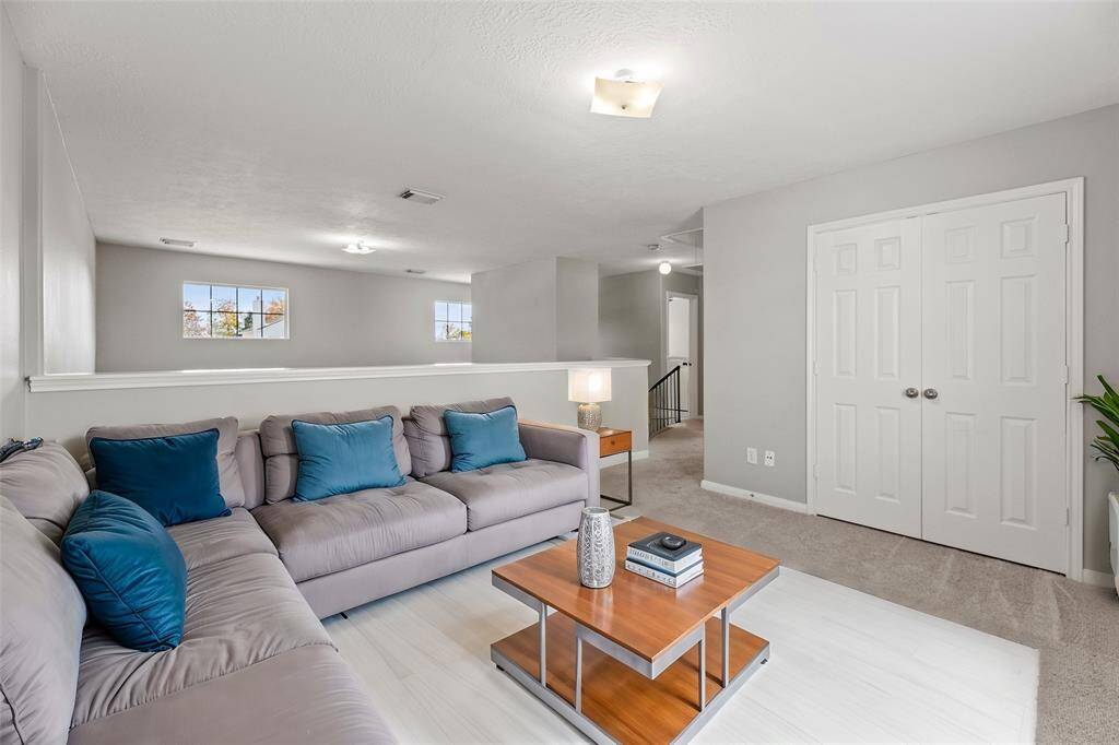 The whole family will love the expansive game room overlooking your living space below.