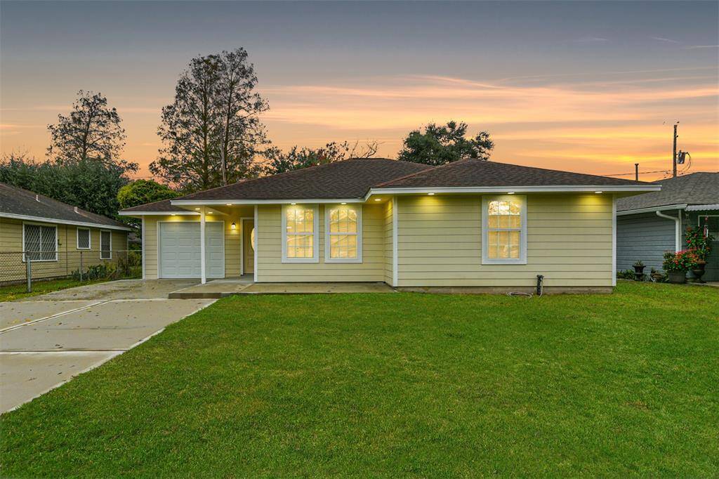 A freshly renovated exterior with new siding, windows, and a brand-new driveway. A welcoming first impression awaits!
