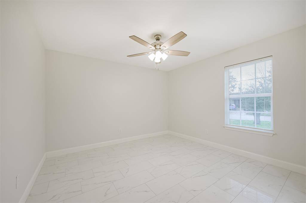 Bright and cozy with modern finishes, this space seamlessly connects to the kitchen for effortless entertaining.