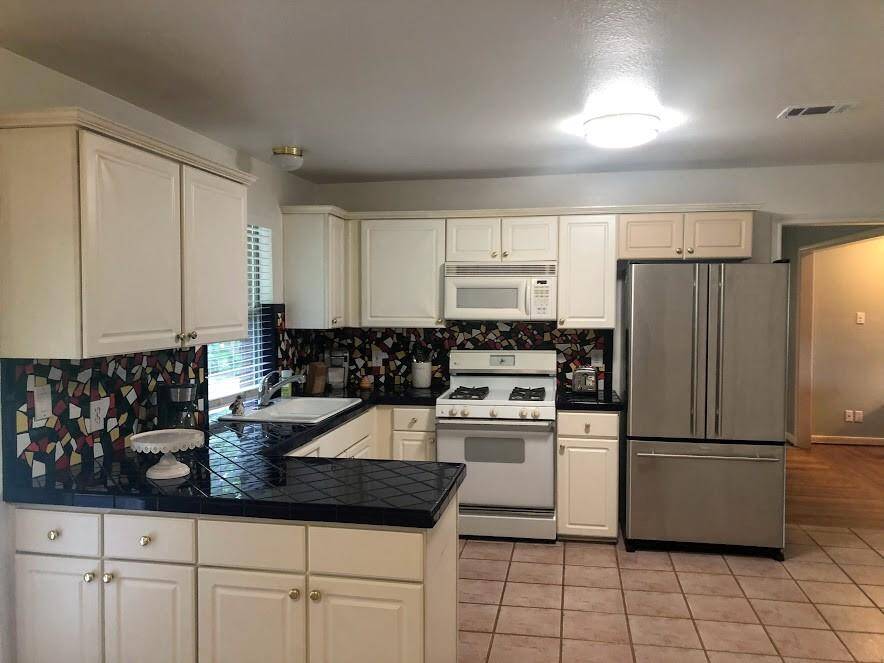 BUILT-IN MICROWAVE, REFRIGERATOR INCLUDED.