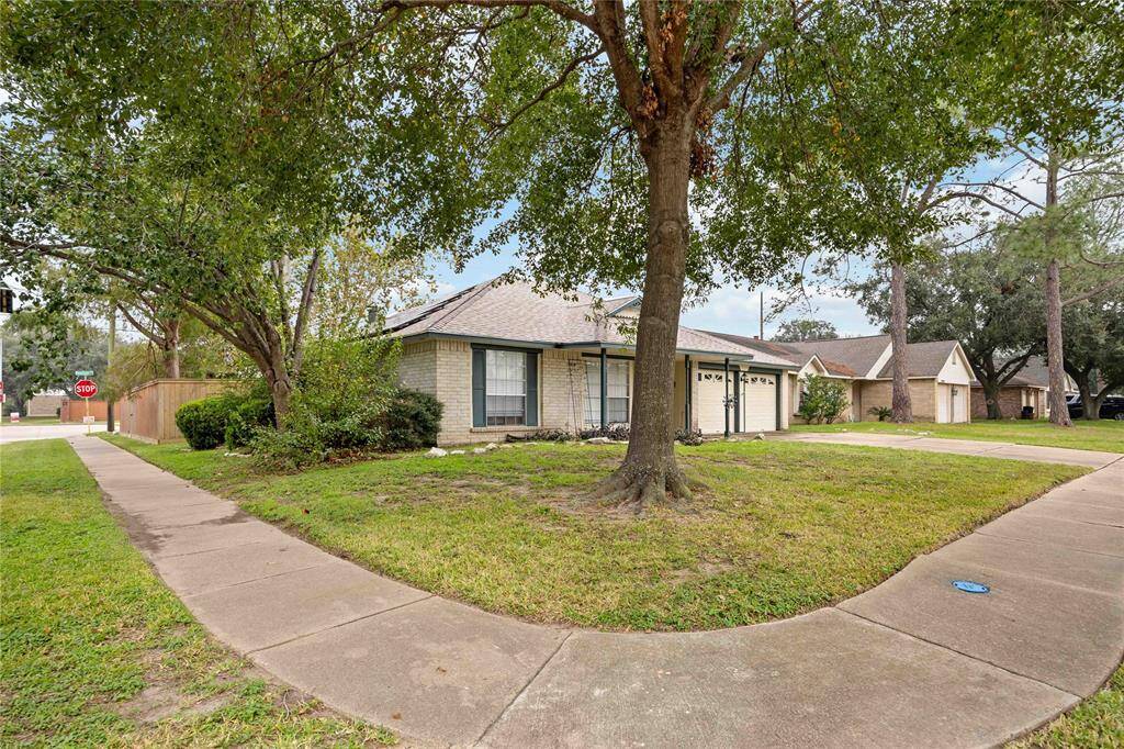 Situated on an oversized corner lot with gorgeous mature trees.