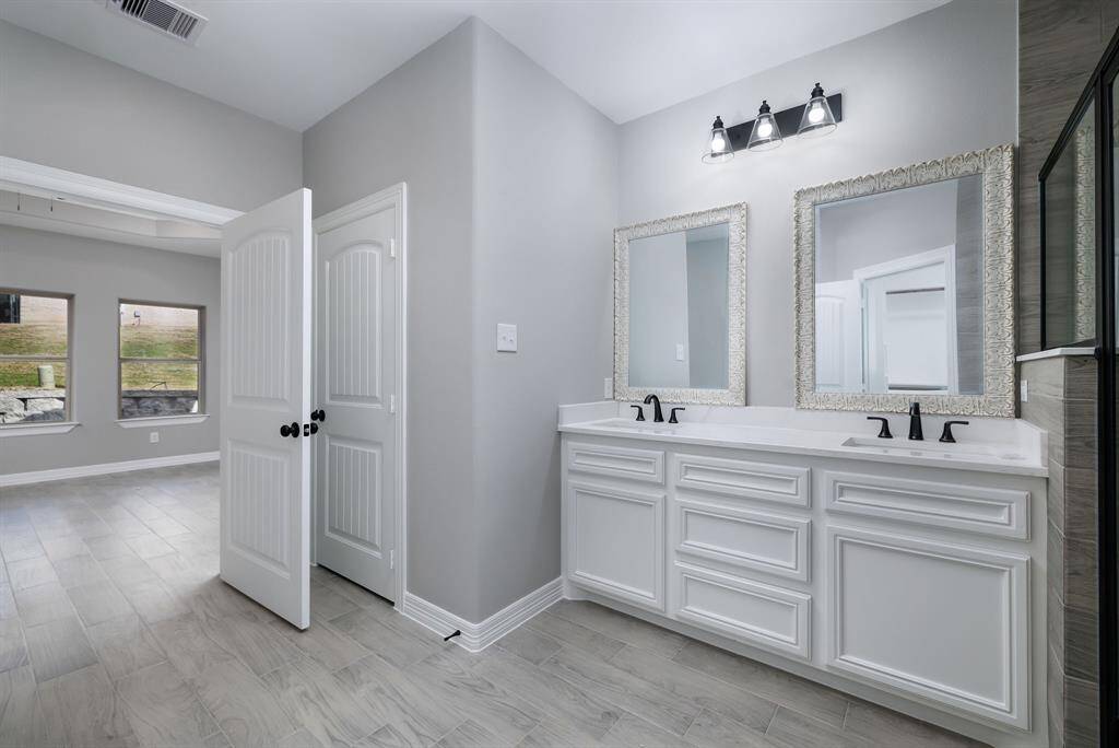 Lots of cabinets and closet in primary bath