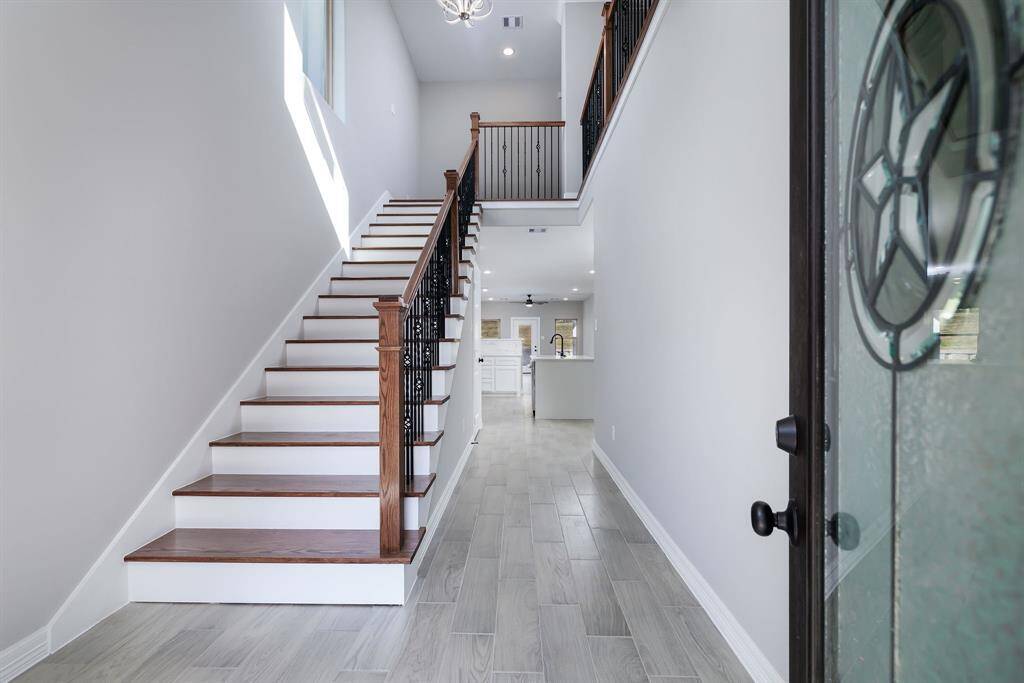 Beautiful stair case and rails.