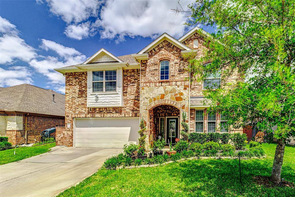 This stunning 5-bedroom residence boasts 3 full bathrooms and a convenient powder room.