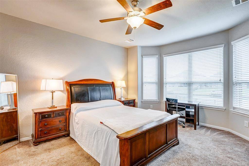 Primary room boasts large windows that offer a stunning view of the lake.