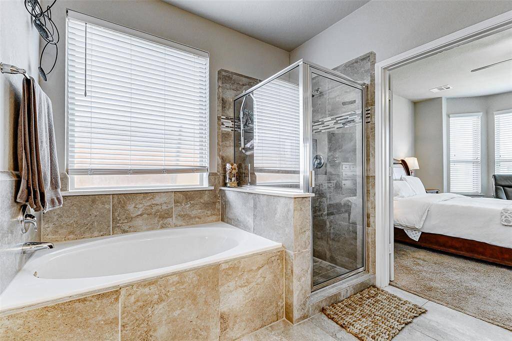 A garden tub is a large, deep soaking tub that is typically freestanding and has a curved backrest for comfortable lounging