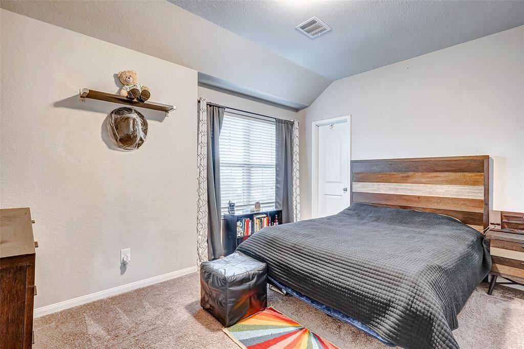 3rd  bedroom has a creating and  warm and inviting atmosphere.
