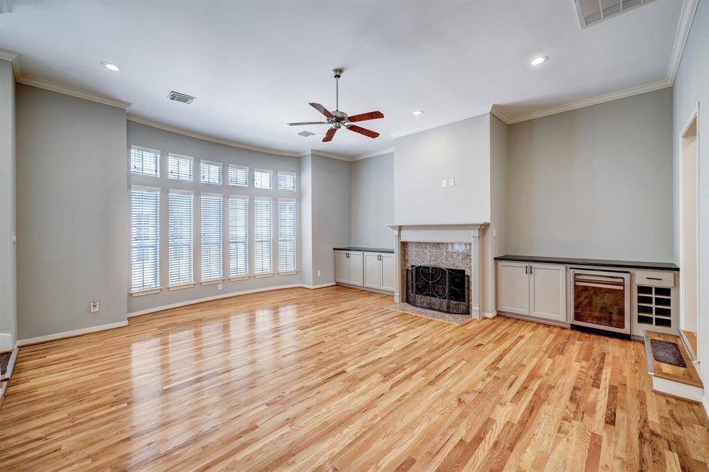 [Living room] Located on the second level features a cozy fireplace instantly creating an atmosphere of warmth and comfort.