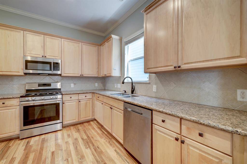 [Kitchen] featuring SS Samsung appliances, ample countertop space and abundance of cabinets for extra storage