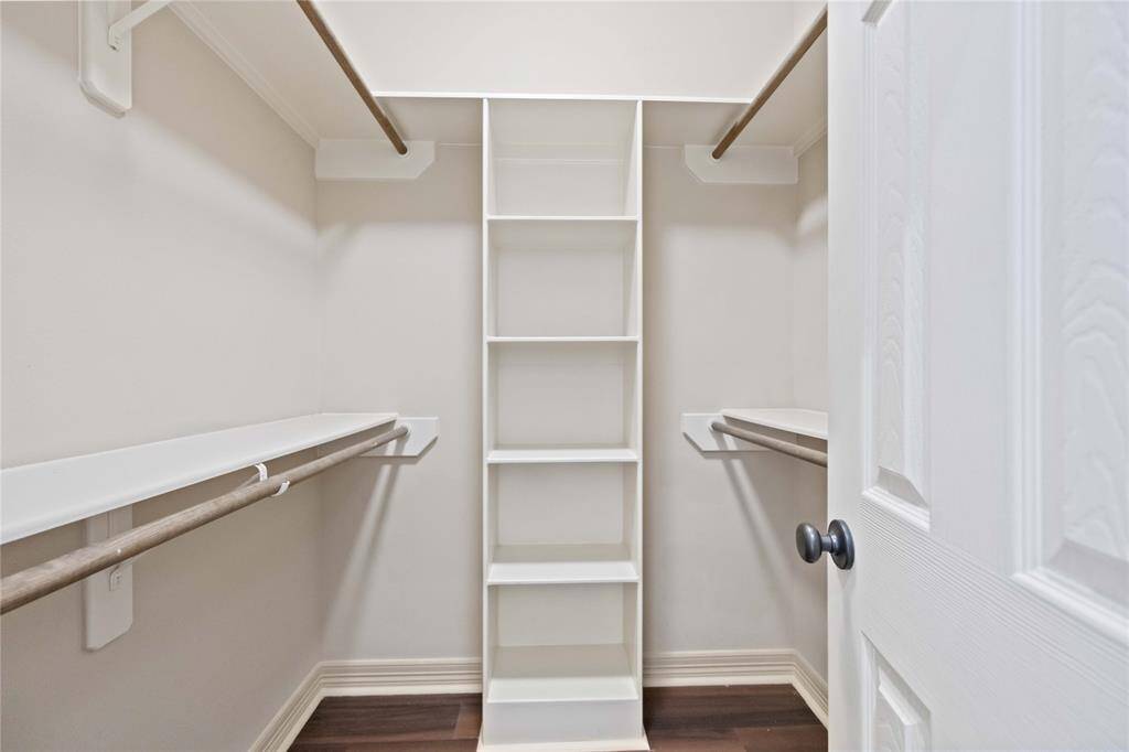 The bathroom features a vanity, toilet, and shower/tub combo, providing ample space.