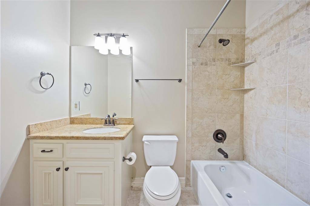 A spa-like experience awaits in this primary bath, featuring a stunning shower and soaking tub.  Pure bliss.
