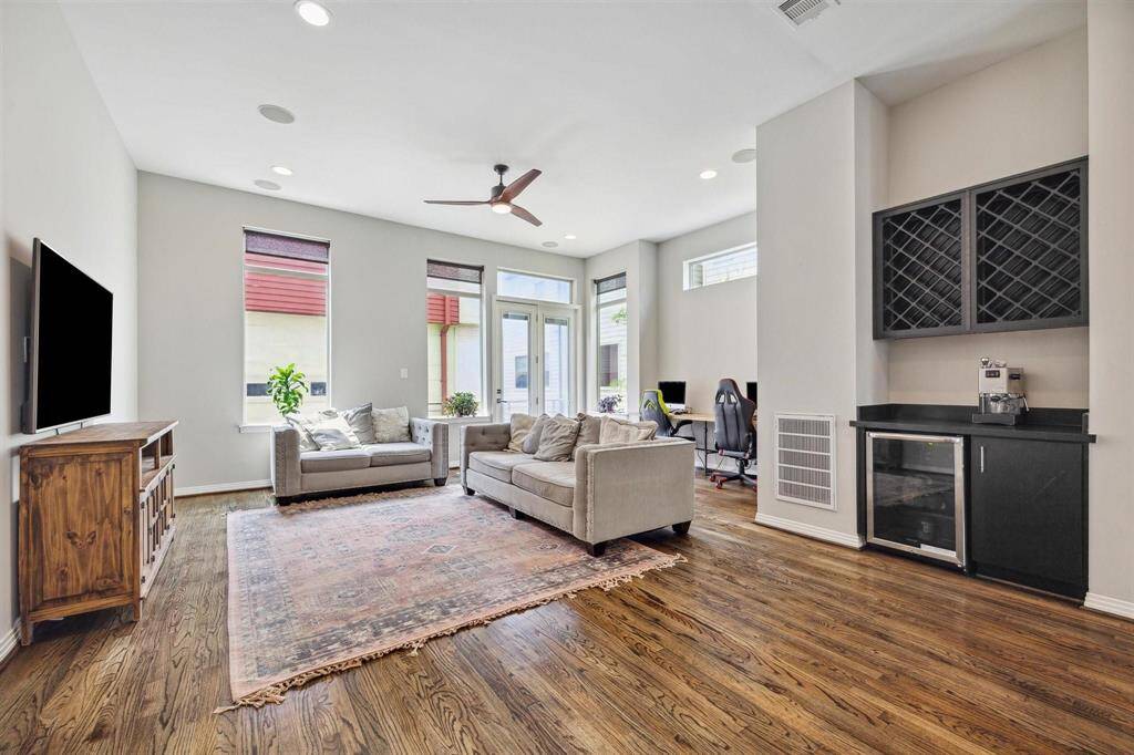 Spacious Living area on second floor with built in wine or coffee bar and fridge.
