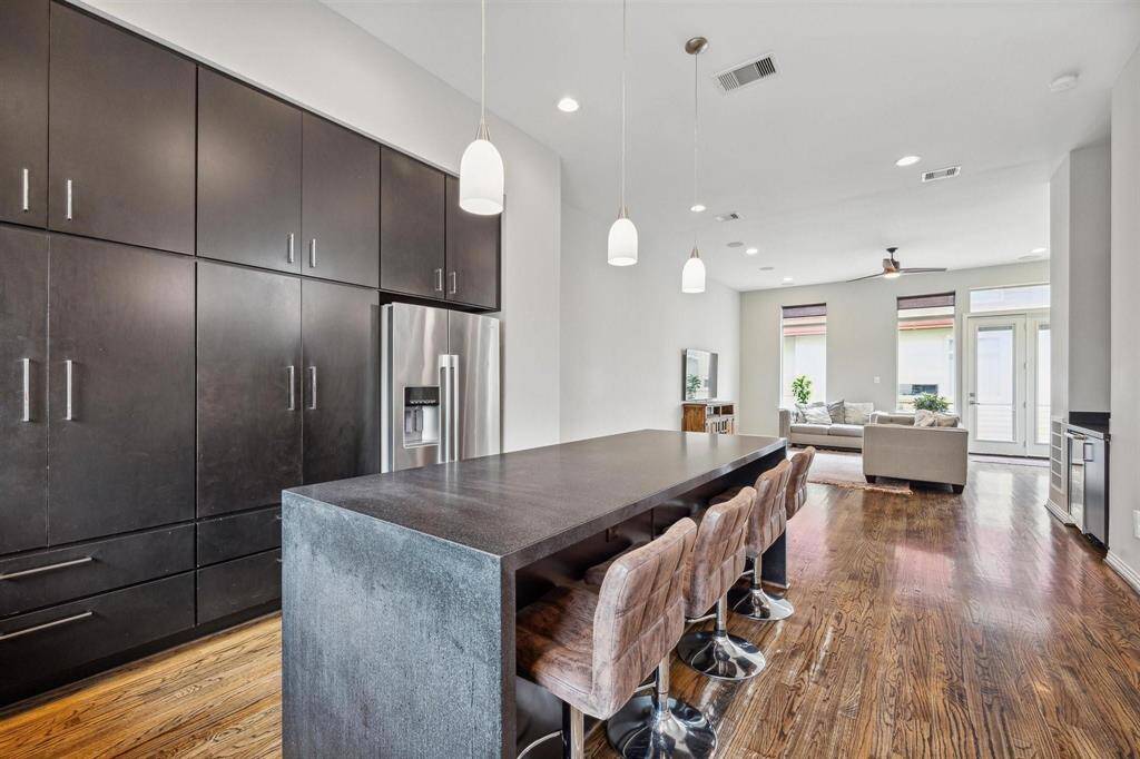 This kitchen has lots of storage and plenty of room for hosting guests.  Bar stools may stay at Buyer's request.