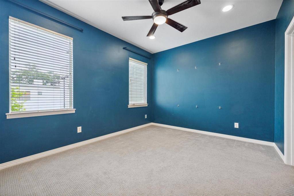 Another view of 3rd floor secondary bedroom with lots of natural light.