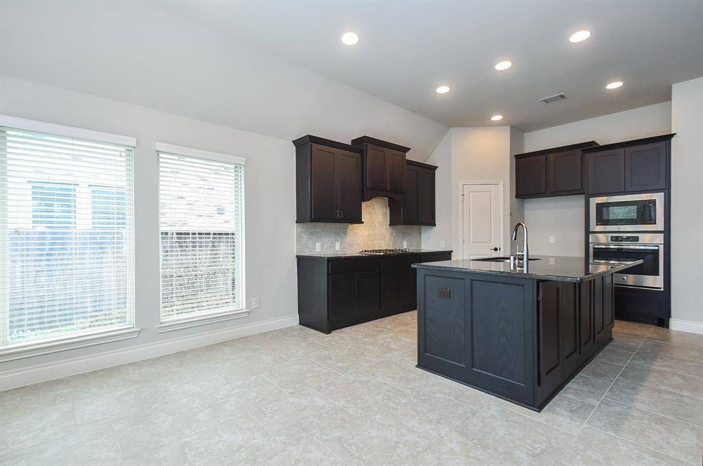Additional view of the kitchen.