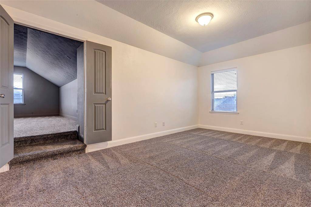 The second floor offers versatile spaces to play, relax, or work, with a large game room and an impressive media room.