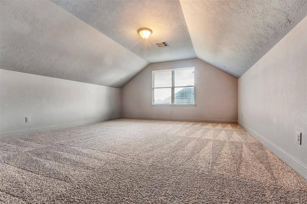 Perfect for movie nights, the media room features double-door entry, darker painted walls, and surround sound connections for a true cinema experience.