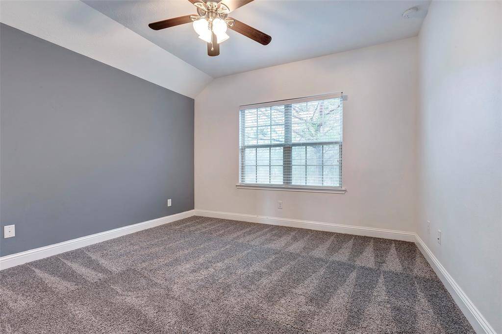 With front yard views, a walk-in closet, and a ceiling fan, Bedroom #3 offers comfort and style. The accent wall adds charm and character to this space.