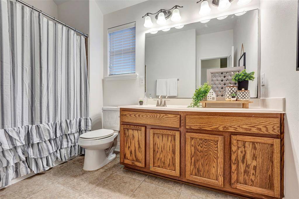 This oversized bathroom, located between bedrooms #3 and #4 is ideal. And the large vanity make getting ready a breeze for a busy family.