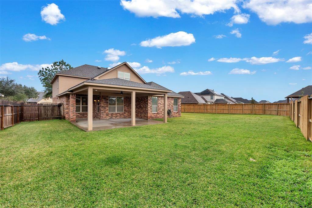 Here's another view of the incredible backyard and patio at 8303 Dakota Hill Ct!
