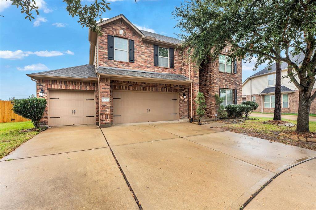 The extra-wide driveway and 3-car garage offer ample space for guests, projects, and game day gatherings, with plenty of storage for vehicles, holiday decorations, and weekend DIY projects.