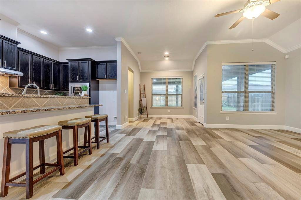 8303 Dakota Hill Ct is such a warm and inviting home. Look how beautifully the heart of the home will welcome you and your guests!