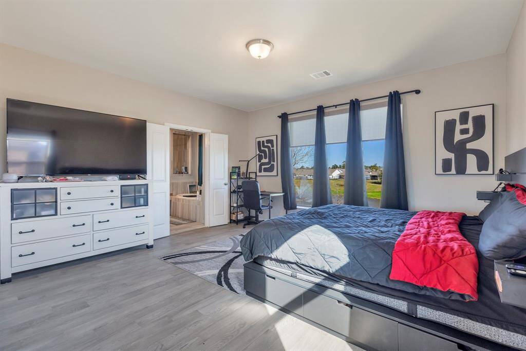 Master bedroom is large enough for all your large furniture. View of lake out the windows is amazing.