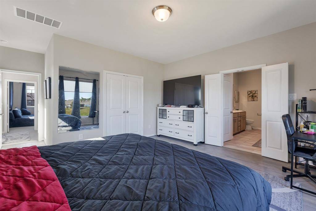 Another view of the Master with the double doored walk in closet and the bath to the right here.