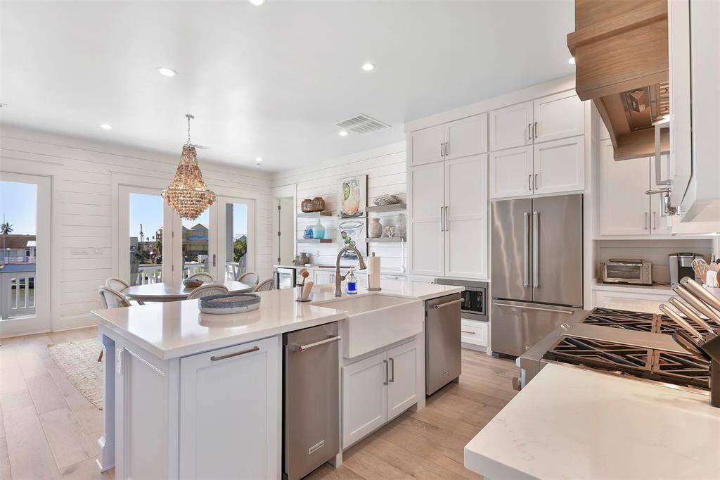 Island houses trash can pull out, separate ice maker and dishwasher