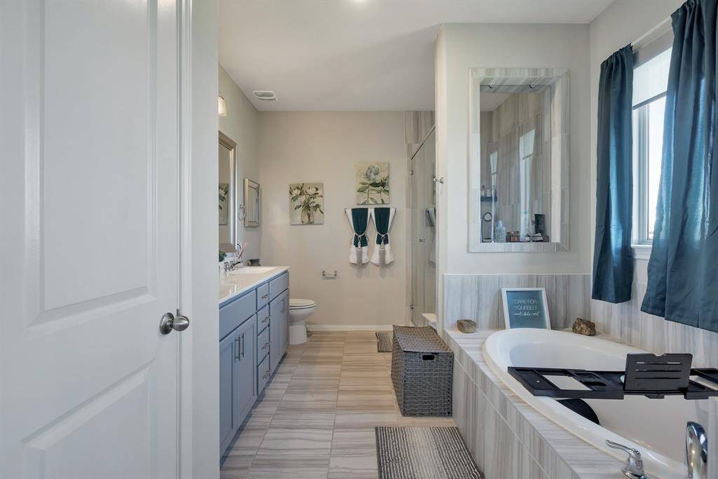 Master bath has the garden tub and separate shower.