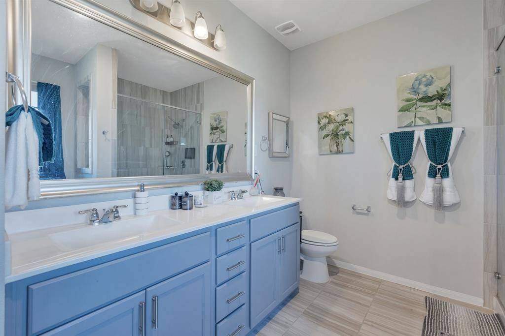 Double sinks and lots of storage space here. There is also a linen closet in the room as well.
