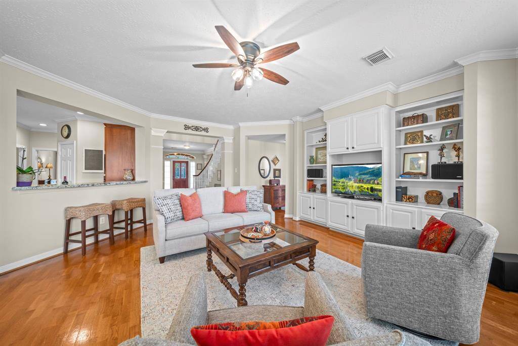 The raised bar seating effortlessly connects the living room to the kitchen!