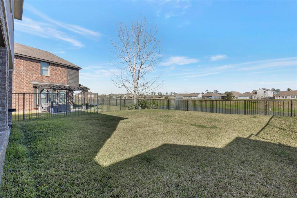 View of the back yard space. You can see the fountain through the fence if you look closely here.