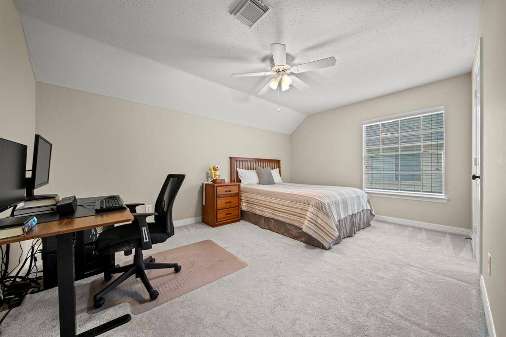 A double step accent stair feature leads to this spacious secondary bedroom!
