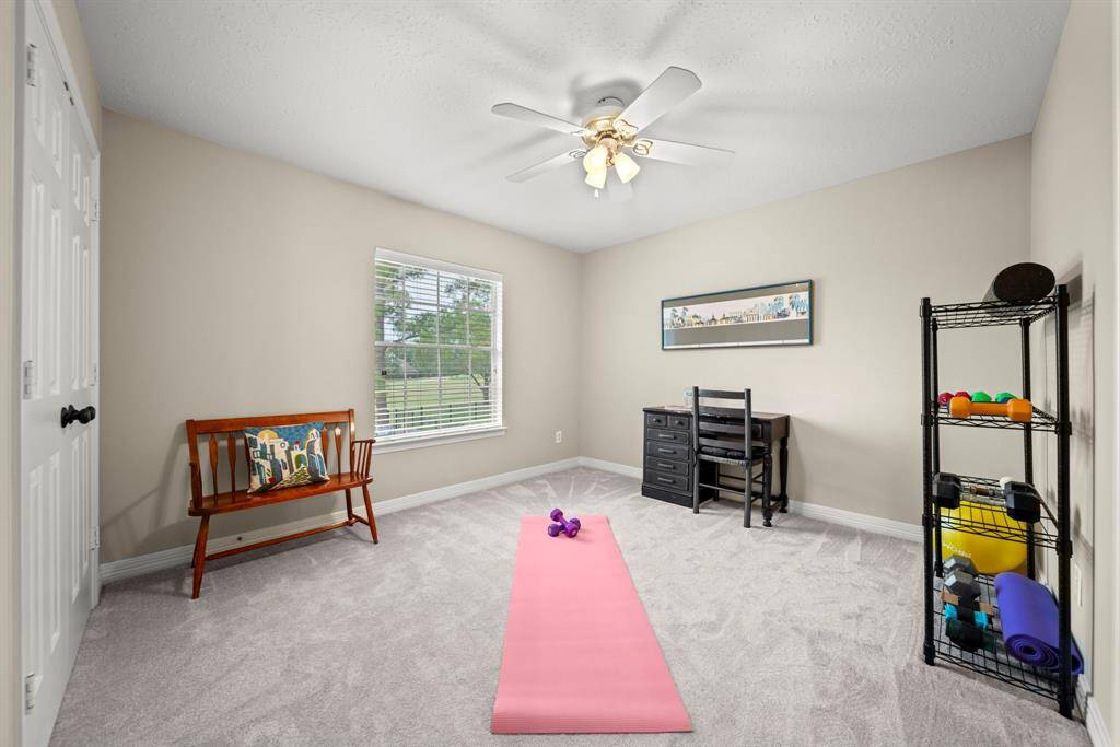 Secondary bedroom overlooks the golf course and features a Hollywood style bathroom!