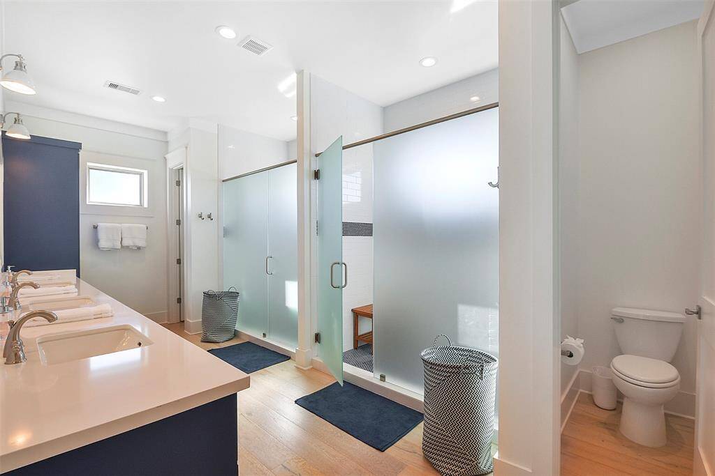 Locker room style bathroom with two huge walk-in showers