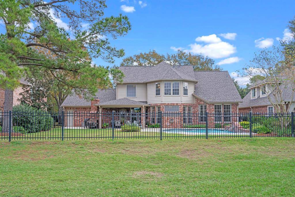 Backyard with wrought iron fence!