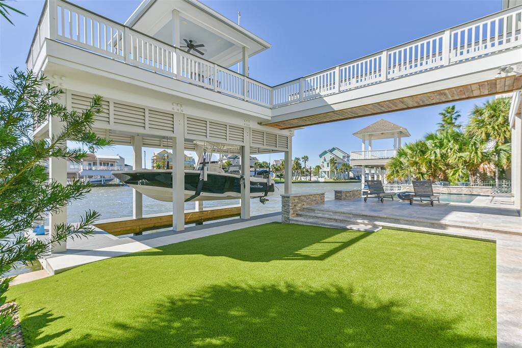 Backyard features low maintenance artifical turf.