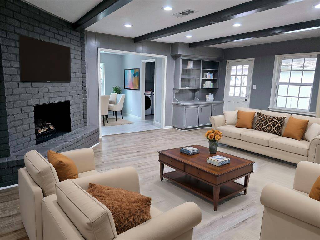 Spacious family room with brick woodburning fireplace -- Virtual staging