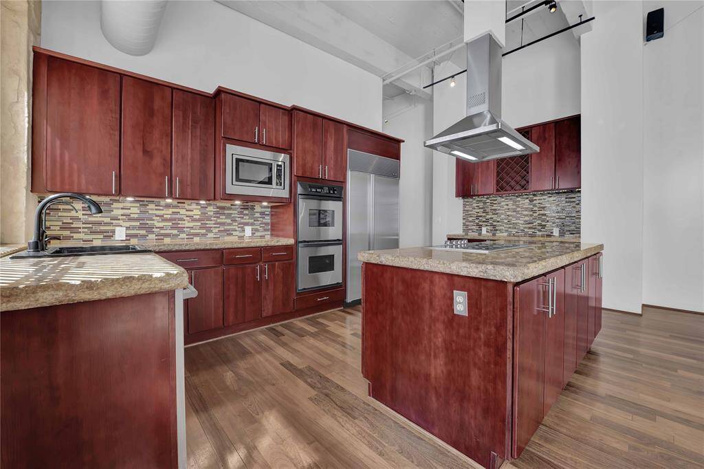Ample storage space in kitchen. look at the thickness of the granite countertops.