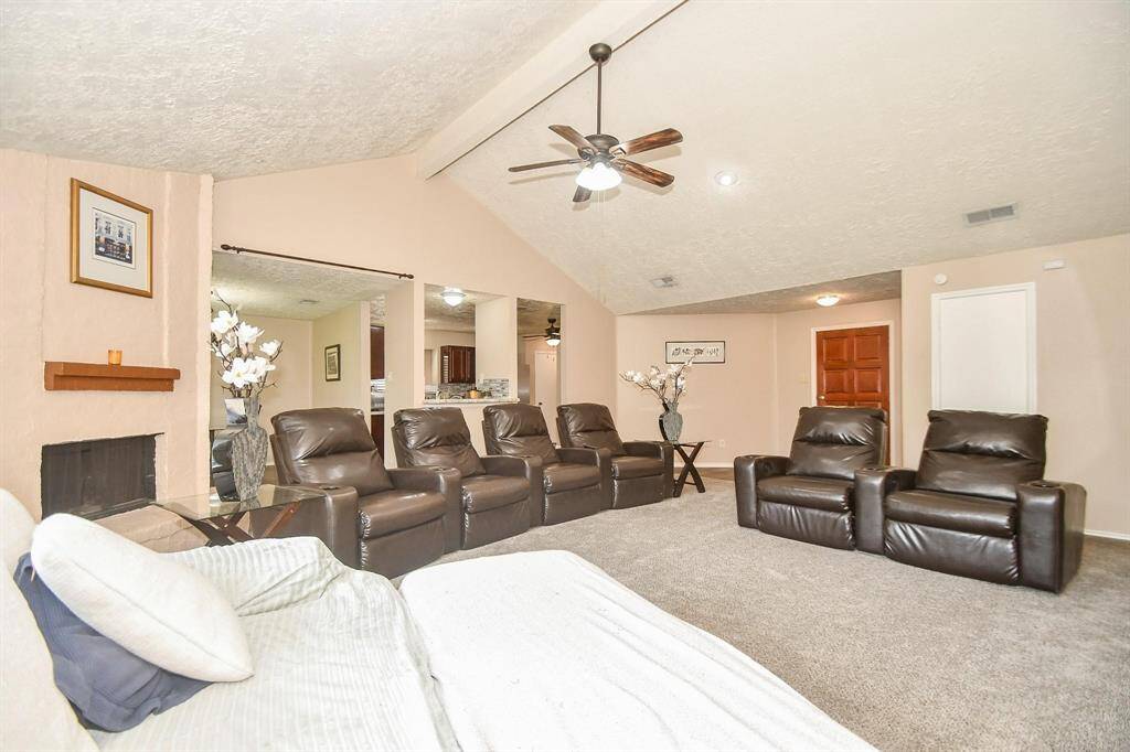 The living space seamlessly connects to the dining and kitchen areas for effortless entertaining.