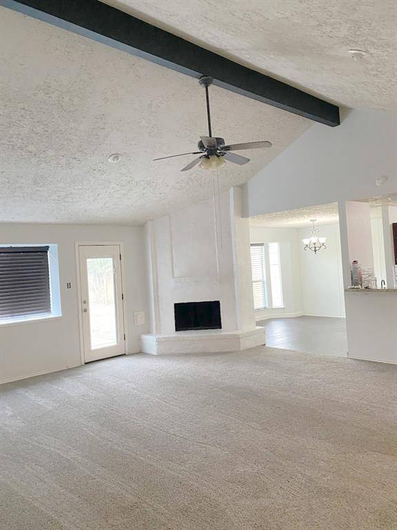 Bright and airy living space featuring a cozy fireplace.